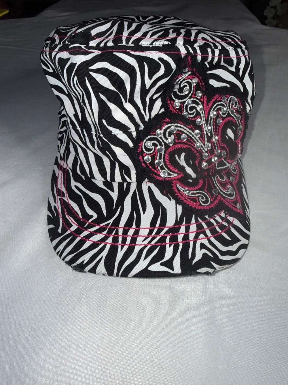 Zebra Print Military-Style Cap with Pink Fleur-de-Lis Accent